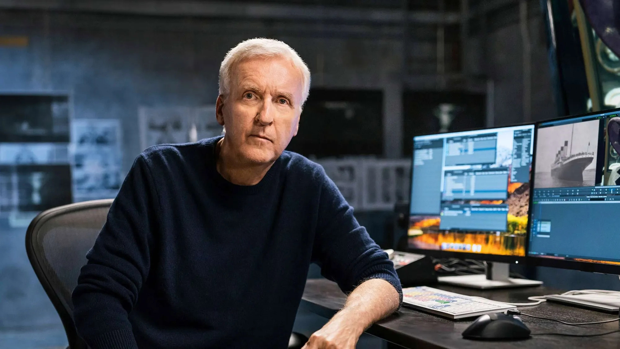 James Cameron working at a computer while teaching filmmaking in his MasterClass program