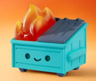 Dumpster Fire toy collectible with flames on top against orange background