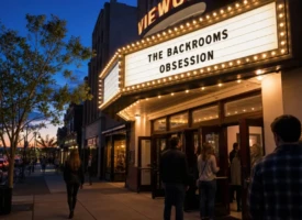 Movie theater marquee displaying The Backrooms and Obsession during evening screenings