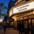 Movie theater marquee displaying The Backrooms and Obsession during evening screenings
