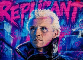 Stylized graffiti mural inspired by Blade Runner featuring a white-haired replicant painted in vibrant blue and magenta on a weathered wall.