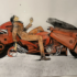 Original Akira artwork depicting Kaneda beside his futuristic motorcycle, on display at the Lucas Museum of Narrative Art.